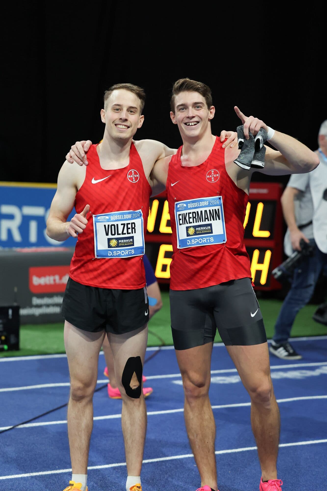 Tim Eikermann celebrating an indoor championship with a teammate